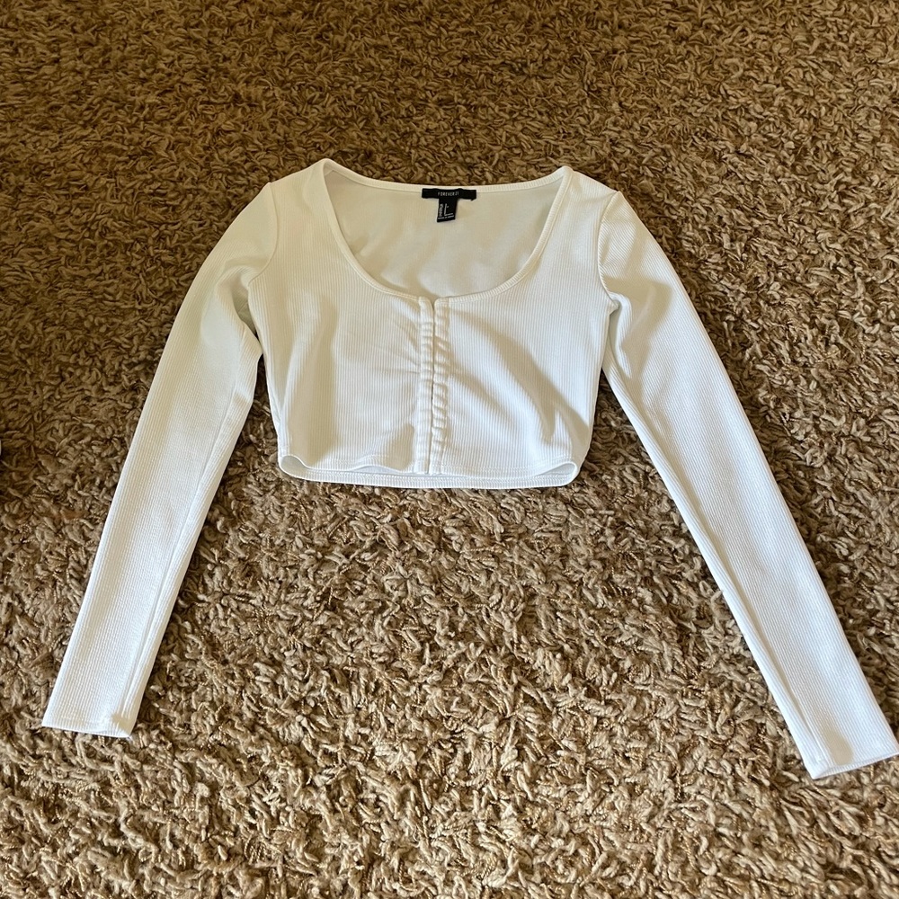 White ribbed eyelet hook long sleeve crop top